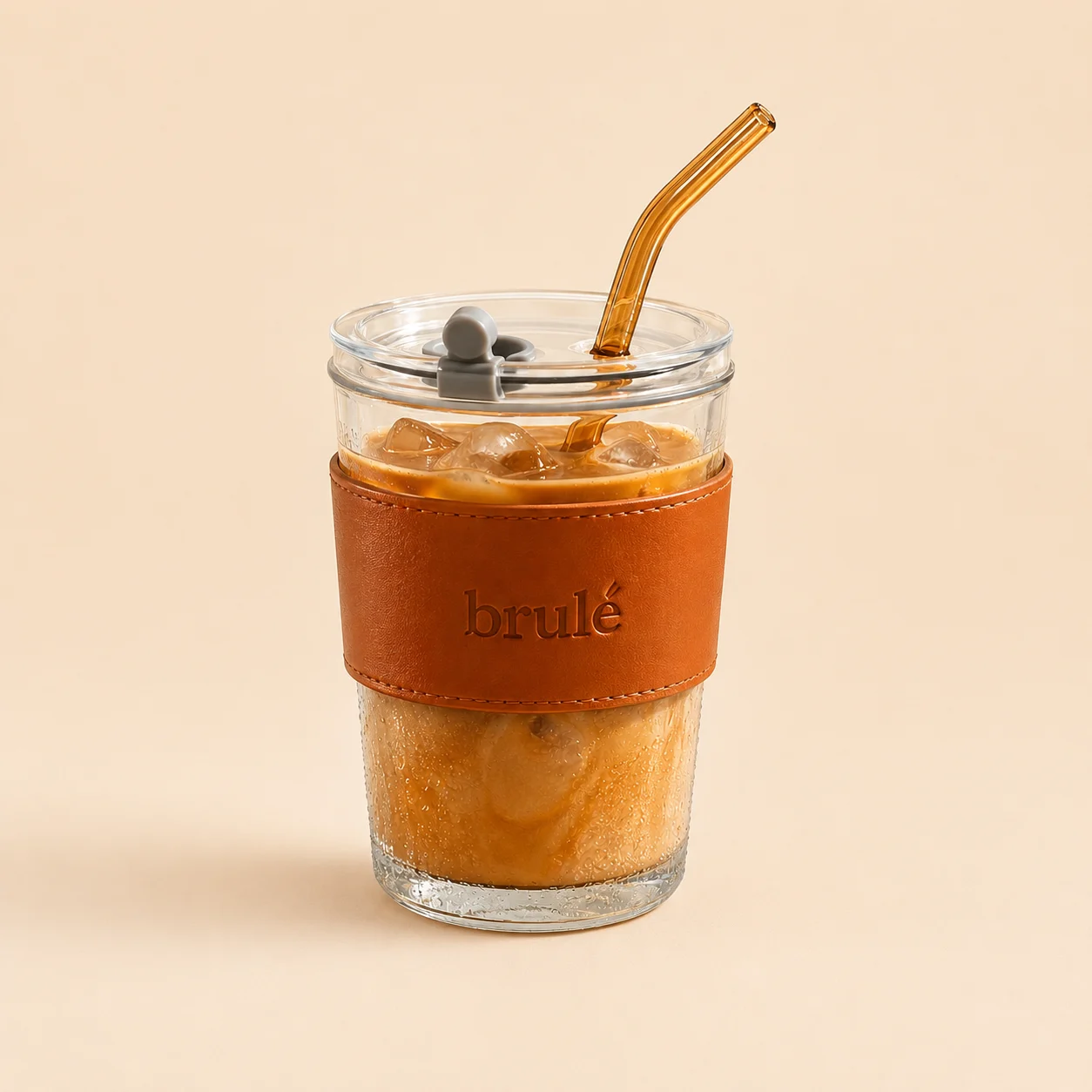 Brulé glass bottle with straw and leather sleeve